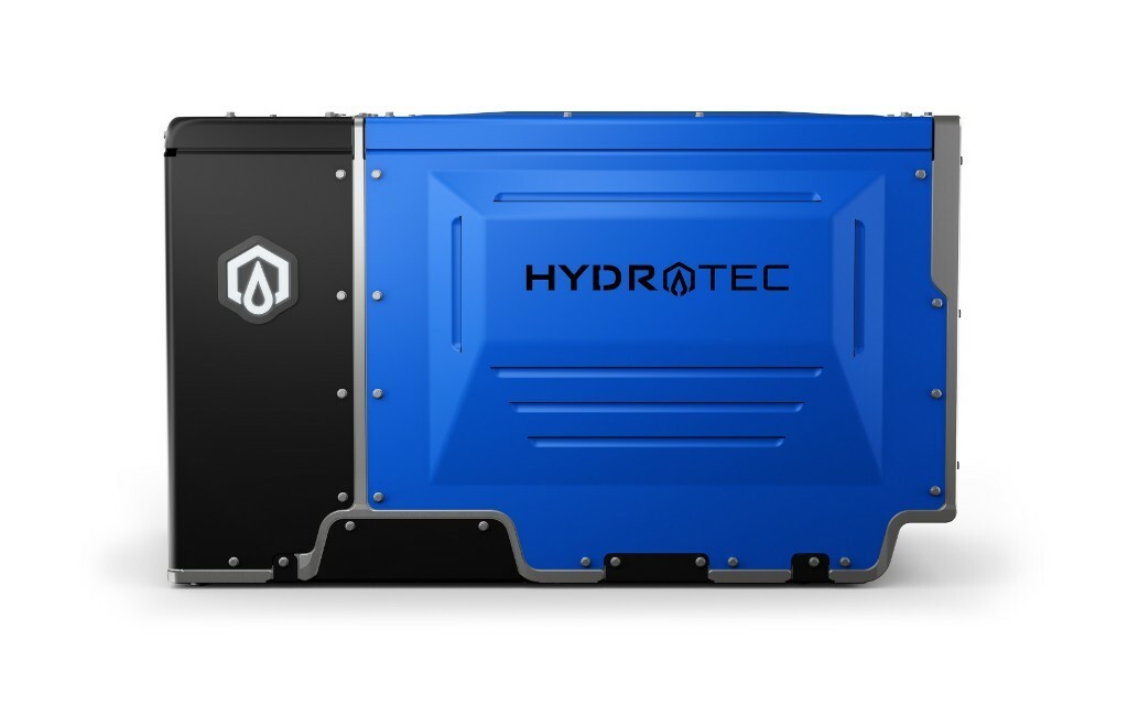 GM Cruise EV Passenger Van With People Sitting Inside Parked In A City